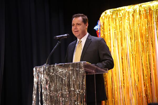 Dr. Dennis Gilliam speaks into the microphone. 
